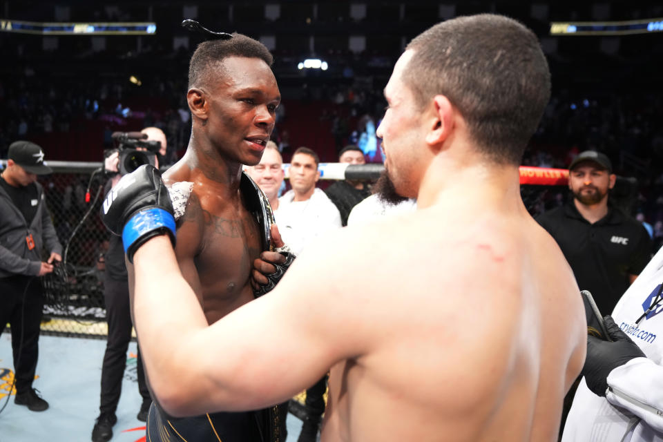 Israel Adesanya and Robert Whittaker, pictured here after their UFC middleweight championship fight.