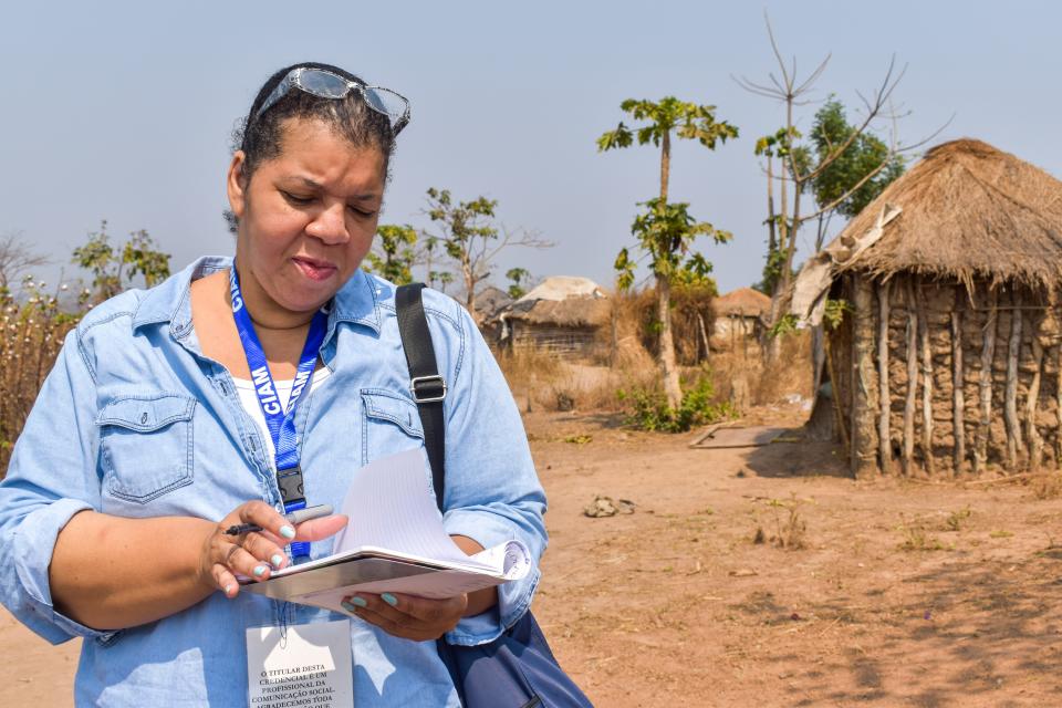 Investigations team editor Nichelle Smith takes notes in a village near Malanje, Angola on August 2, 2019. USA TODAY accompanied family historian Wanda Tucker to the African nation for the newspaper's 1619 Project.