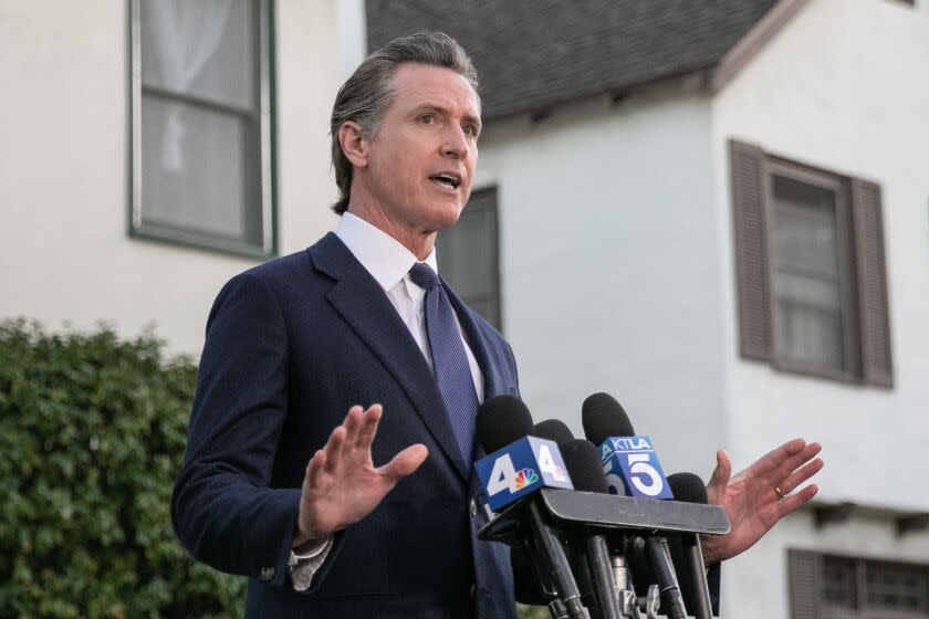 SAN MARINO, CA - JANUARY 23: Gavin Newsom visits with Brandon Tsay who disarmed the gunman who opened fire at a ballroom dance studio in Monterey Park on Monday, Jan. 23, 2023 in San Marino, CA. (Jason Armond / Los Angeles Times)