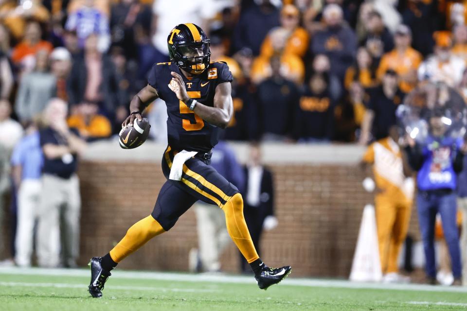 Tennessee quarterback Hendon Hooker (5) rolls out to pass during the first half of an NCAA college football game against Kentucky, Saturday, Oct. 29, 2022, in Knoxville, Tenn. (AP Photo/Wade Payne)