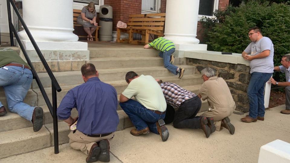 More than 100 residents gathered on the Madison County Courthouse lawn in downtown Marshall - as well as on the sidewalk across the street - to participate in an anti-abortion rally July 13, 2022, organized by local pastors.