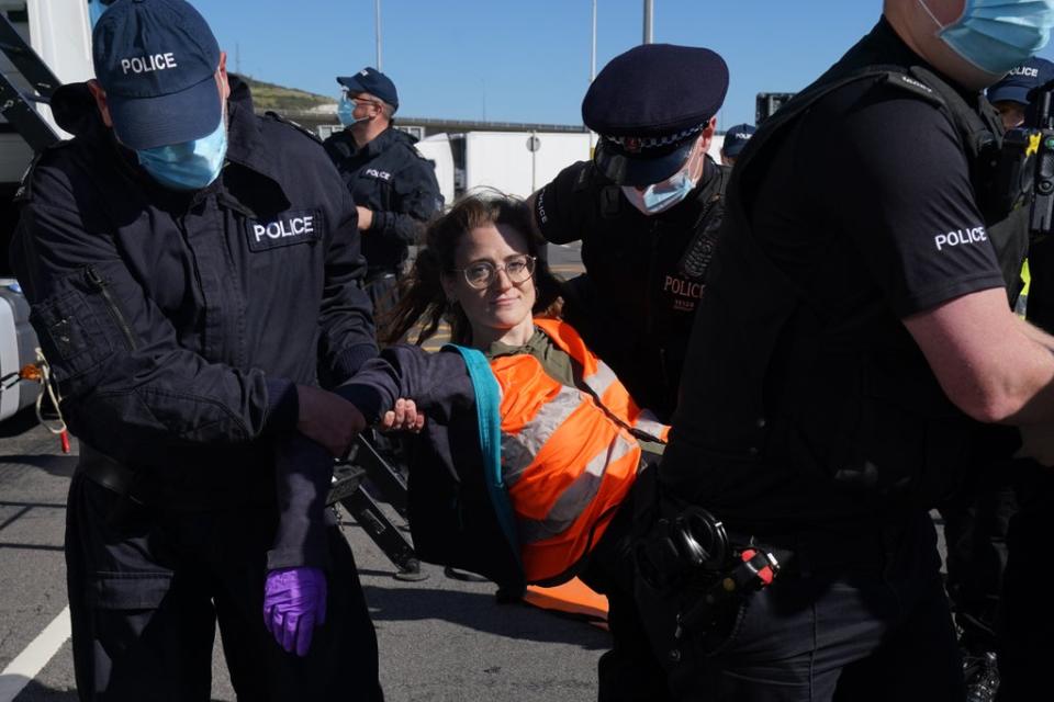 Police remove a protester who was on top of a tanker (Gareth Fuller/PA) (PA Wire)