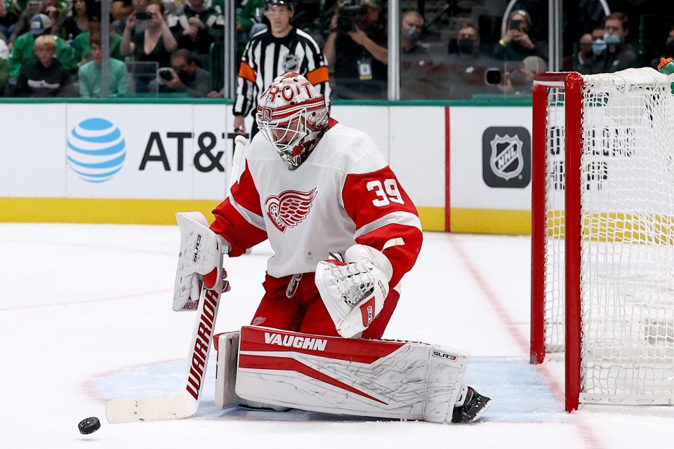 Red Wings goalie Alex Nedeljkovic blocks a shot on goal against the Stars in the first period on Tuesday, Nov. 16, 2021, in Dallas.