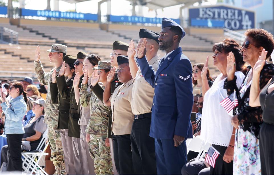 Members of the U.S. armed forces are sworn in as they become U.S. citizens at a naturalization ceremony at Dodger Stadium on Aug. 29, 2022, in Los Angeles.