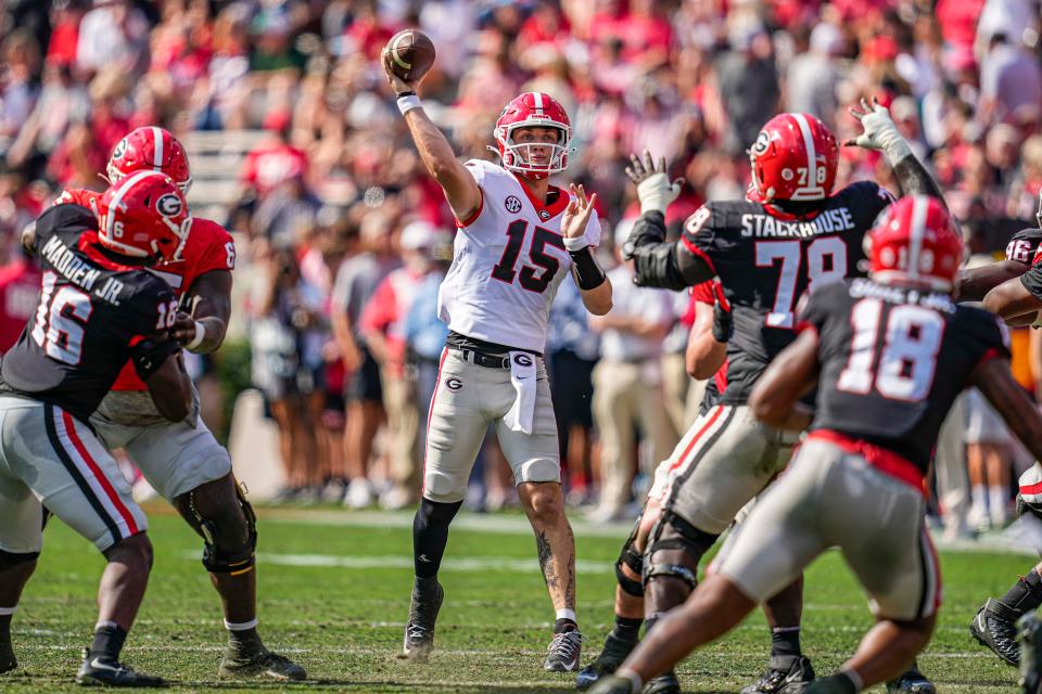 Georgia quarterback Carson Beck (15) passes during the team's spring game at Sanford Stadium.