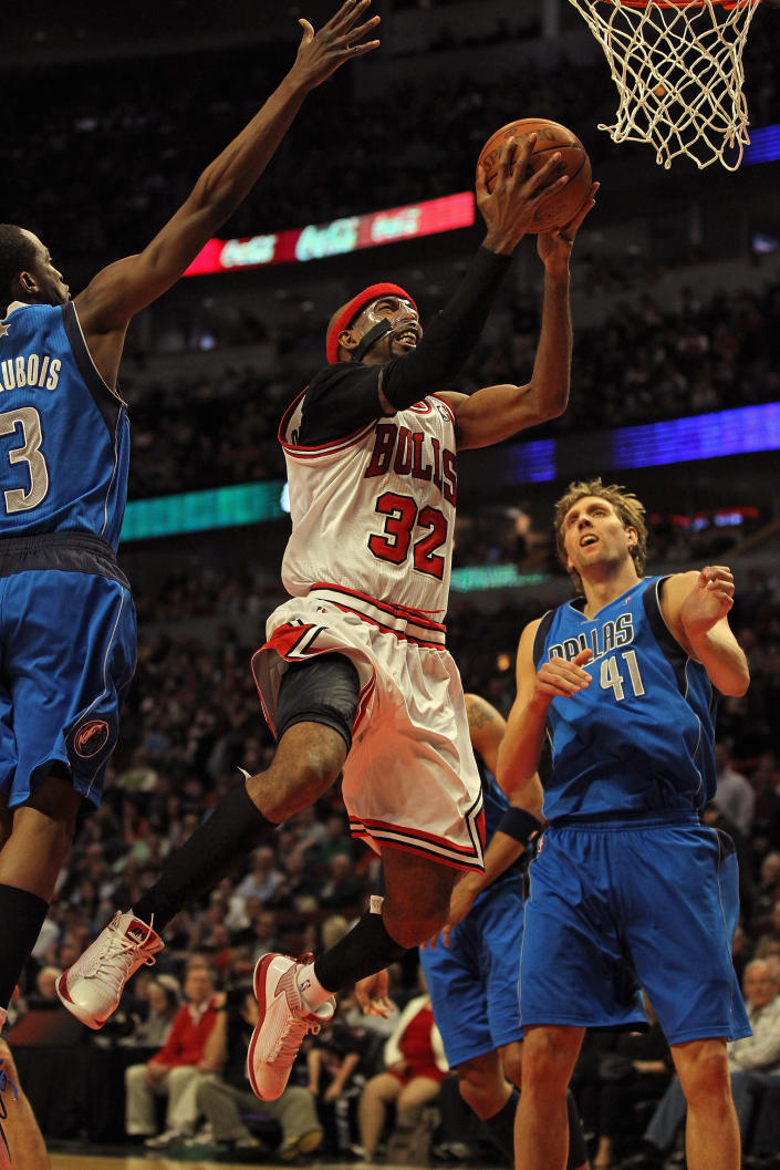 CHICAGO, IL - APRIL 21: Richard Hamilton #32 of the Chicago Bulls drives to the basket between Rodrigue Baeubois #3 and Dirk Nowitzki #41 of the Dallas Mavericks at the United Center on April 21, 2012 in Chicago, Illinois. The Bulls defeated the Mavericks 93-83. NOTE TO USER: User expressly acknowledges and agress that, by downloading and/or using this photograph, User is consenting to the terms and conditions of the Getty Images License Agreement. (Photo by Jonathan Daniel/Getty Images)