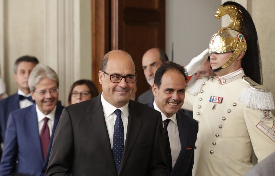 Democratic Party leader Nicola Zingaretti, center, leaves after meeting Italian President Sergio Mattarella, in Rome, Thursday, Aug. 22, 2019. President Sergio Mattarella continued receiving political leaders Thursday, to explore if a solid majority with staying power exists in Parliament for a new government that could win the required confidence vote. (AP Photo/Alessandra Tarantino)