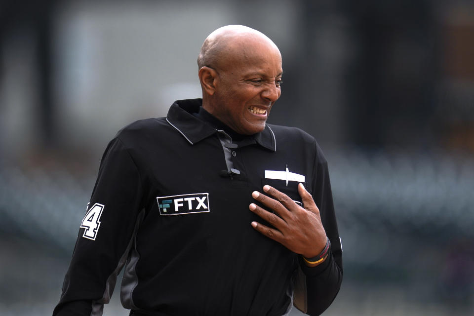 Home plate umpire CB Bucknor reacts after being hit by a pitch before the Boston Red Sox-Detroit Tigers baseball game in Detroit, Wednesday, April 13, 2022. (AP Photo/Paul Sancya)