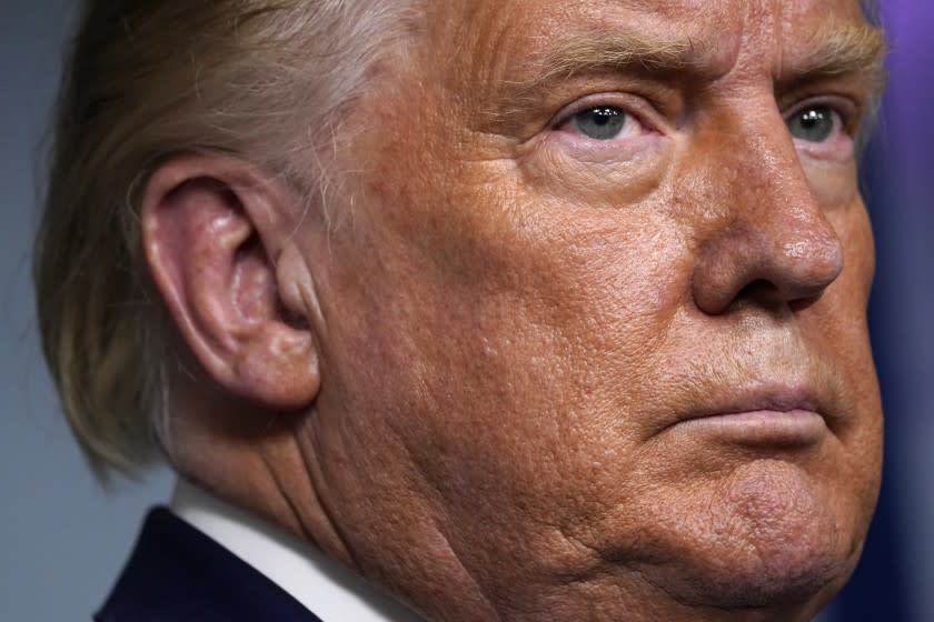 President Donald Trump listens during a news conference in the James Brady Press Briefing Room at the White House, Friday, Sept. 4, 2020, in Washington. (AP Photo/Evan Vucci)