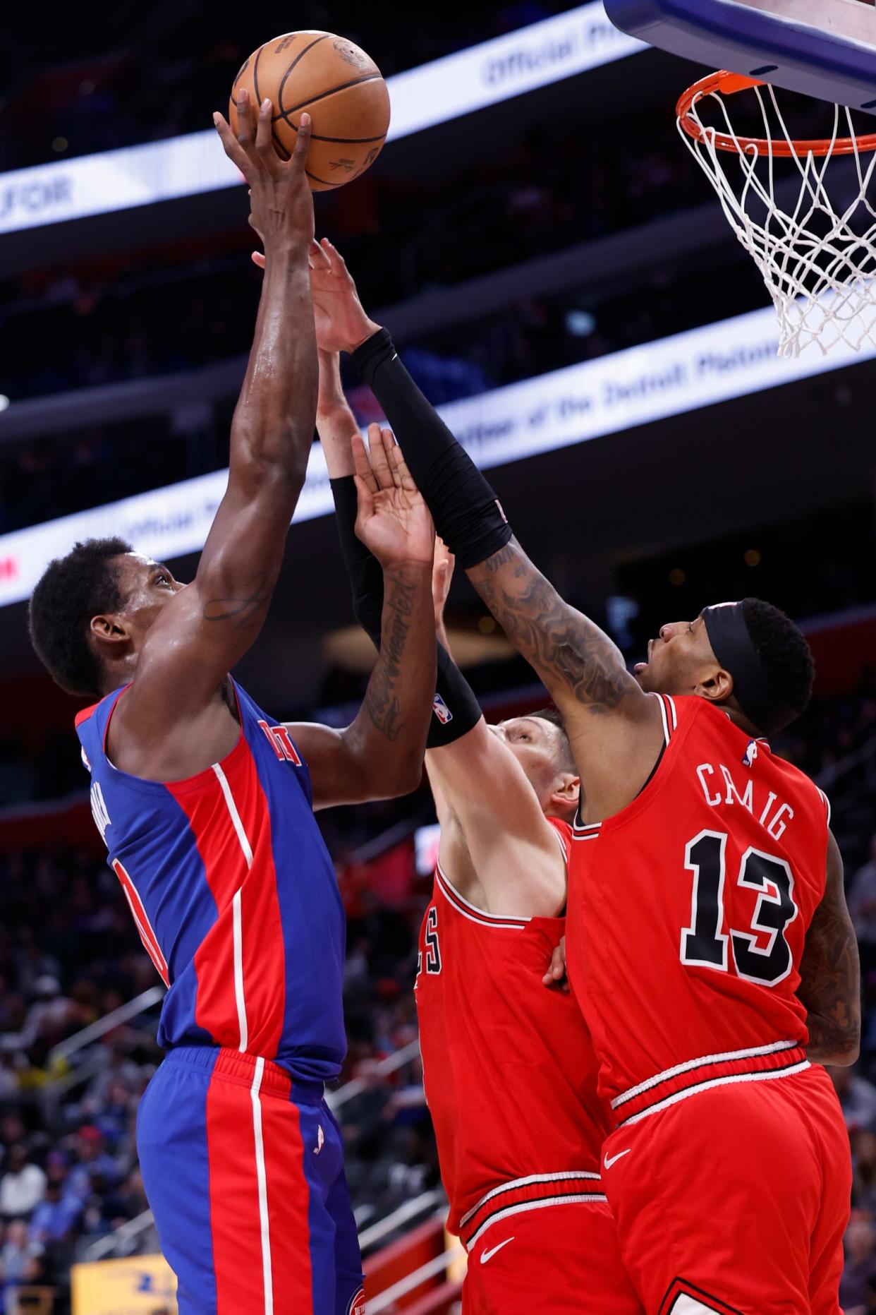 Pistons center Jalen Duren shoots on Bulls forward Torrey Craig in the first half on Thursday, April 11, 2024, at Little Caesars Arena.