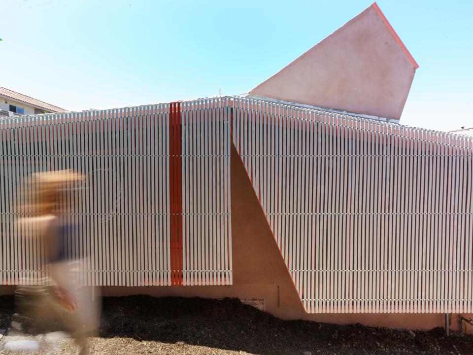 The guest house features a quirky vaulted window.