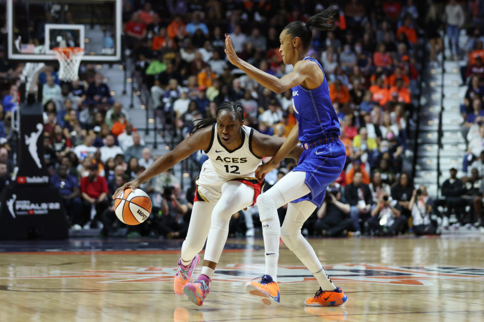 Chelsea Gray of the Las Vegas Aces dribbles against DeWanna Bonner of the Connecticut Sun during Game 3 of the 2022 WNBA Finals at Mohegan Sun Arena in Uncasville, Connecticut, on Sept. 15, 2022. (Maddie Meyer/Getty Images)