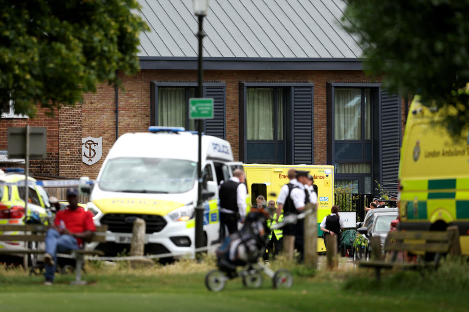 Police and emergency services attend the scene of a car crash at a school on July 6, 2023 in Wimbledon, England. / Credit: Julian Finney/Getty