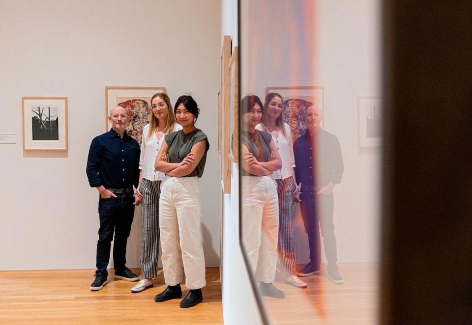 Marshall Price, chief curator, Julia McHugh, curator and director of academic initiatives, and Julianne Miao, curatorial assistant, are pictured in an exhibit curated by A.I. at the Nasher Museum of Art at Duke University on Thursday, Sept. 14, 2023, in Durham, N.C. The A.I. model, designed by a Duke professor, selected artworks for the exhibition and gave it a title — “Dreams of Tomorrow: Utopian and Dystopian Visions.”