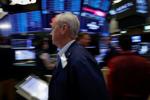 Traders work on the floor of the New York Stock Exchange (NYSE) in New York, U.S., July 6, 2018. REUTERS/Brendan McDermid