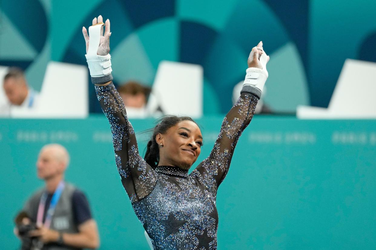 Simone Biles of the United States performs on the uneven bars in women’s qualification during the 2024 Paris Olympics at Bercy Arena.