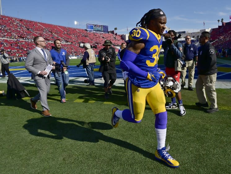 Todd Gurley runs off the field following the Rams' season finale against the Cardinals on Dec. 29 at the Coliseum.