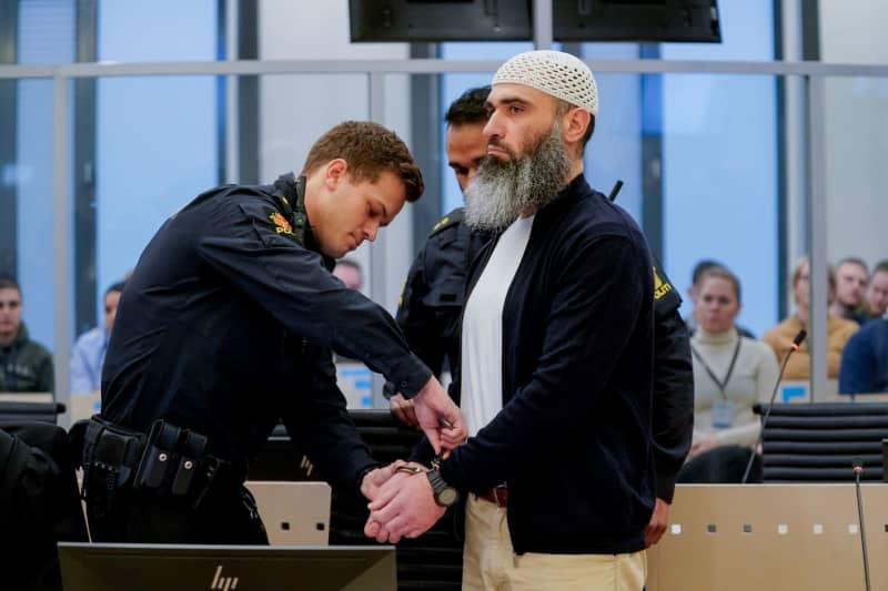 Zaniar Matapour, a Norwegian with an Iranian family background, is led into the courtroom 250 in Oslo courthouse, where he is on trial for Oslo gay bar shooting in 2022. Lise Åserud/ntb/dpa