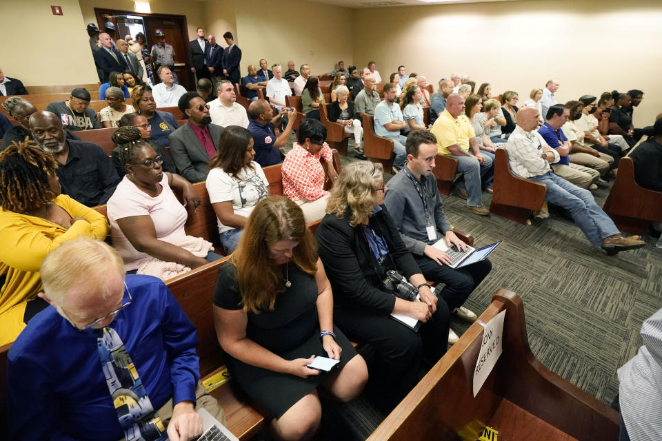 A full courtroom of journalists, family and friends attend a hearing in the Rankin County Circuit Court, in Brandon, Miss., where six former Mississippi law officers pleaded guilty to state charges on Monday, Aug. 14, 2023, for torturing two Black men in a racist assault that ended with an officer shooting one victim in the mouth. (AP Photo/Rogelio V. Solis)