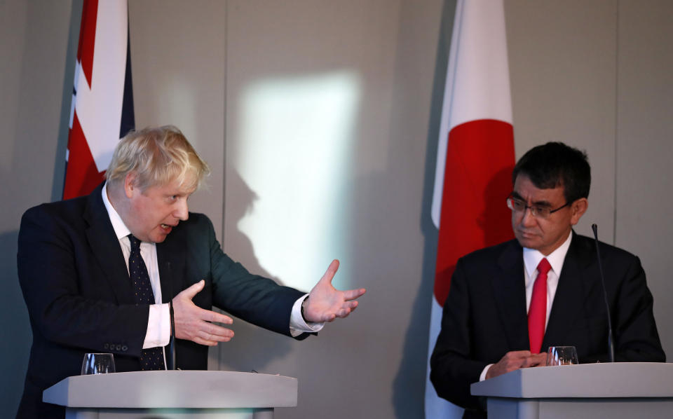 Britain's Foreign Secretary Boris Johnson, left, speaks alongside his Japanese counterpart Foreign Minister Taro Kono during a press conference at the National Maritime Museum in Greenwich, London, Thursday, Dec. 14, 2017. (AP Photo/Kirsty Wigglesworth, pool)