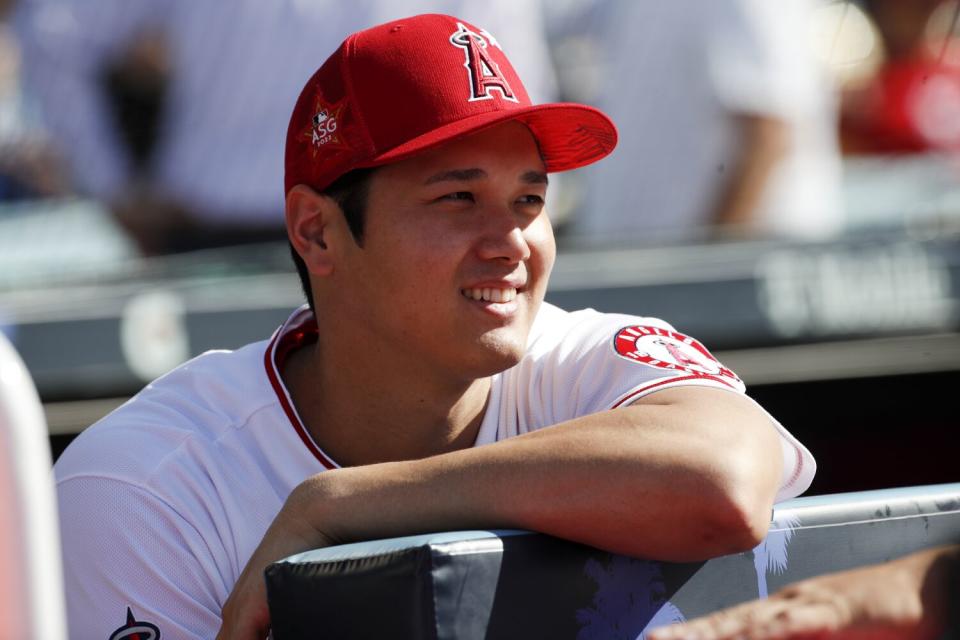 Angels star Shohei Ohtani watches from the dugout before the MLB All-Star home run derby at Dodger Stadium in July.