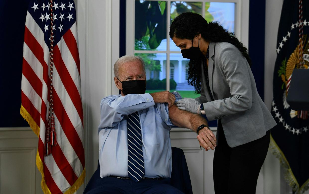 US President Joe Biden receives a third shot of the Pfizer Covid-19 vaccine as a booster on the White House campus September 27, 2021, in Washington, DC. (AFP via Getty Images)