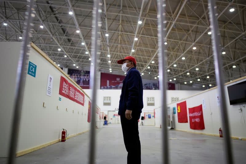 Volunteer is seen inside a convention center that was used as a makeshift hospital in Wuhan