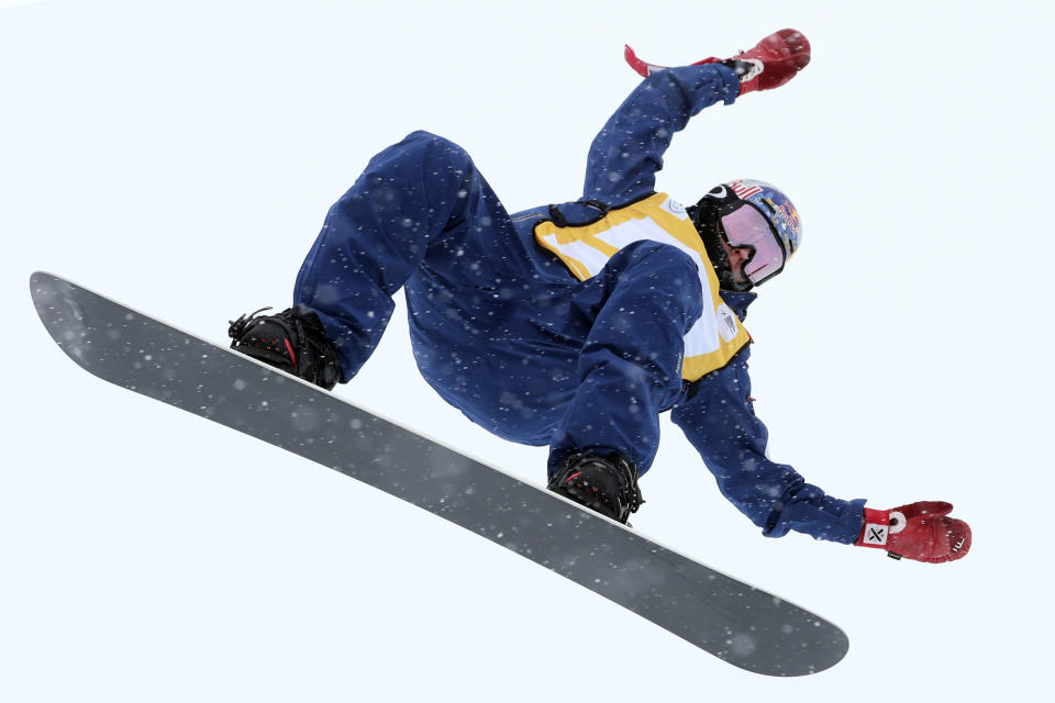 FILE - Gold medalist Australia's Scotty James jumps in the Men's Snowboard Halfpipe for the FIS Snowboard World Cup held in Chongli county near Zhangjiakou in northern China's Hebei province on Sunday, Dec. 22, 2019. Tucked away on a private halfpipe in Switzerland, Scotty James has been charting the future. He envisions the best tricks at this year’s biggest halfpipe contests as the kind that only he can perform. (AP Photo/Ng Han Guan, File)