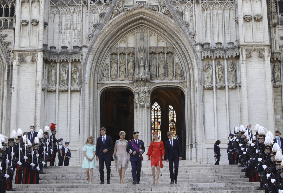 Belgium's Royal Family, from left, Princess Eleonore, Prince Gabriel, Queen Mathilde, King Philippe, Crown Princess Elisabeth and Prince Emmanuel leave after a religious service at the St. Gudula cathedral in Brussels, Wednesday, July 21, 2021. Belgium celebrates its National Day on Wednesday in a scaled down version due to coronavirus, COVID-19 measures. (AP Photo/Olivier Matthys)