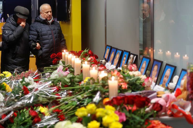 Relatives of the flight crew members of the Ukraine International Airlines Boeing 737-800 plane that crashed in Iran, mourn at a memorial at the Boryspil International airport