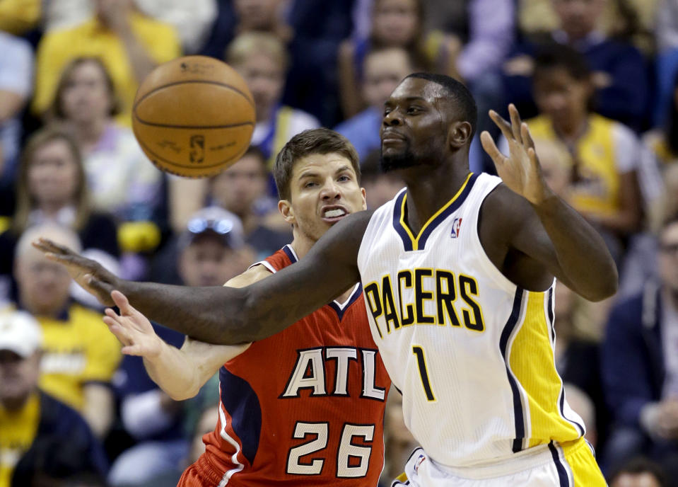 Indiana Pacers' Lance Stephenson (1) loses control of the ball as Atlanta Hawks' Kyle Korver (26) defends during the first half in Game 5 of an opening-round NBA basketball playoff series Monday, April 28, 2014, in Indianapolis. (AP Photo/Darron Cummings)