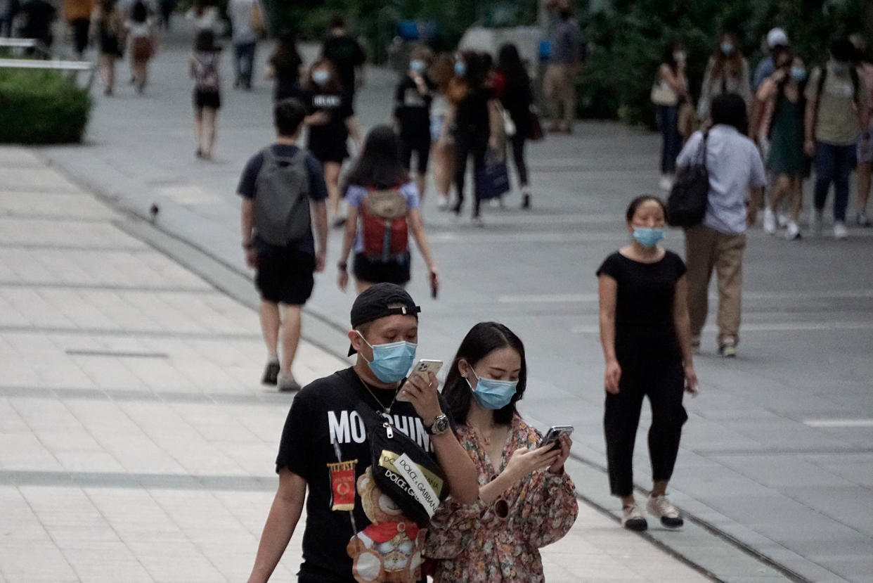 People in face masks seen along Orchard Road on 19 June 2020, the first day of Phase 2 of Singapore’s re-opening. (PHOTO: Dhany Osman / Yahoo News Singapore)