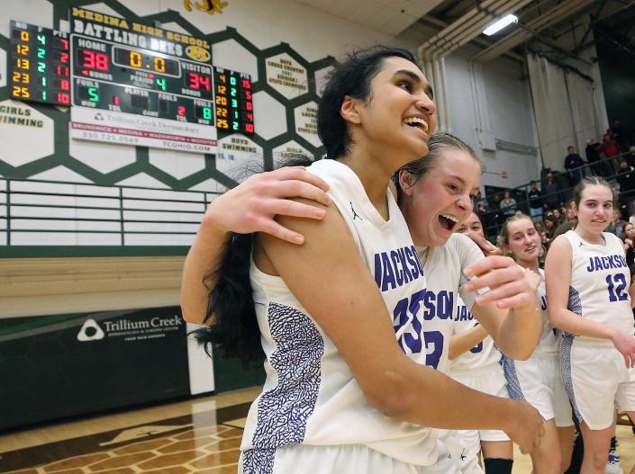 Jackson&#39;s Leena Patibandla (left) and Lauren Pallotta celebrate after the Polar Bears&#39; 38-34 victory over St. Joseph Academy in the Division I regional championship game at Medina on Saturday.
