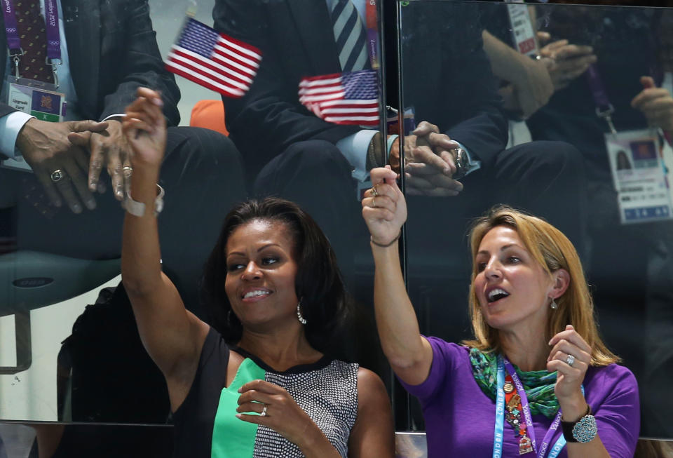 LONDON, ENGLAND - JULY 28: First Lady of the United States, Michelle Obama supports the USA Olympic Swim team along with Summer Sanders durng the evening session of the swimming on Day 1 of the London 2012 Olympic Games at the Aquatics Centre on July 28, 2012 in London, England. (Photo by Clive Rose/Getty Images)
