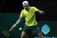 Australia's Alex de Minaur returns the ball to Canada's Felix Auger Aliassime during the final Davis Cup tennis match between Australia and Canada in Malaga, Spain, Sunday, Nov. 27, 2022. (AP Photo/Joan Monfort)