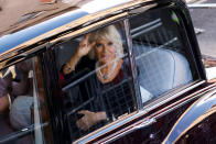 <p>Britain's Camilla, the Queen Consort waves as she and Britain's King Charles III are driven along the Royal Mile towards the Palace of Holyroodhouse, in Edinburgh, Scotland, Monday, Sept. 12, 2022. (Odd Andersen/Pool Photo via AP)</p> 