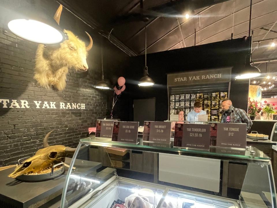 Star Yak Ranch section of store with coolers of jerky and a yak head on the wall