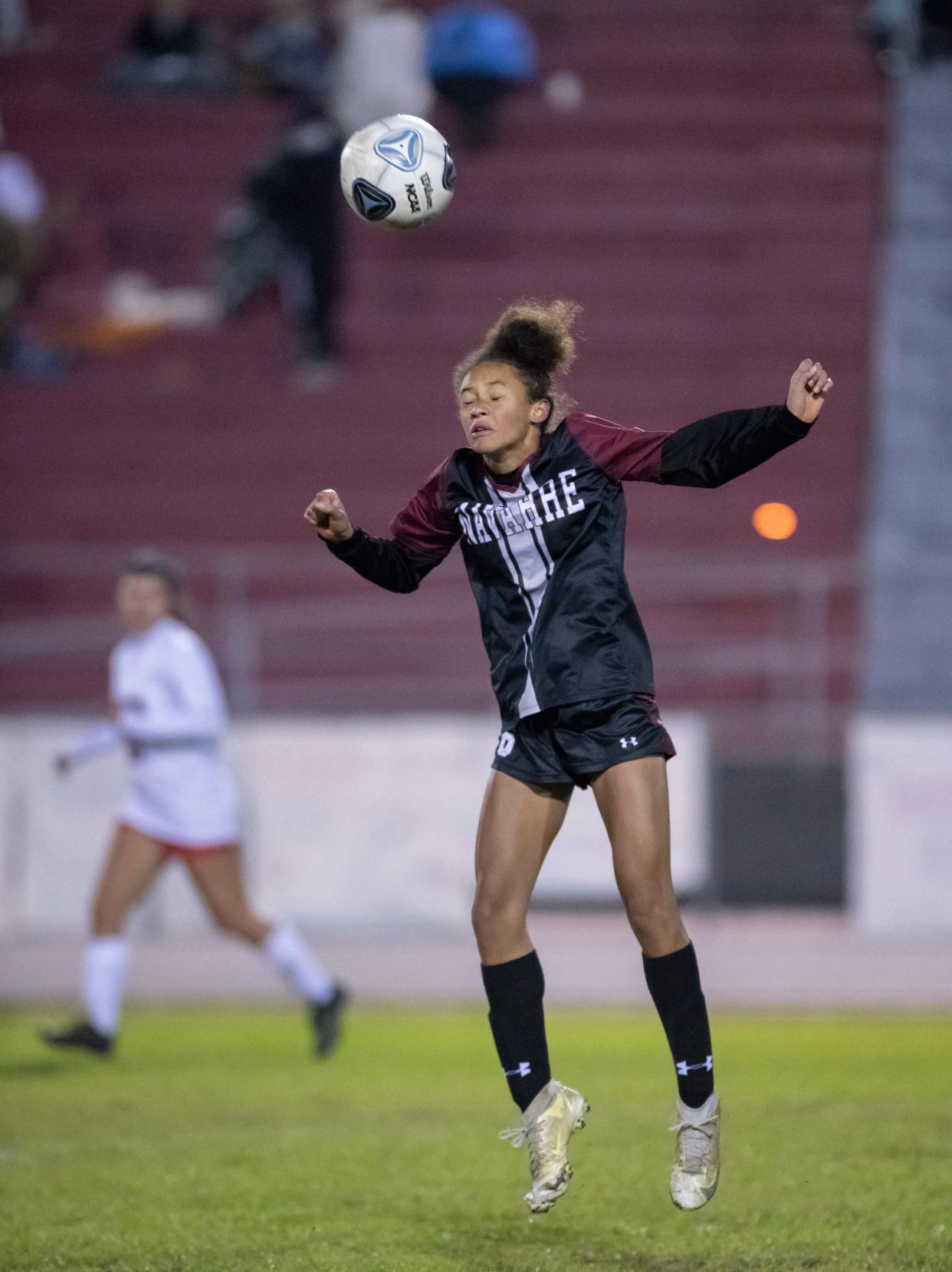 Cici Buffalino (6) heads the ball during the Pace vs Navarre girls soccer game at Navarre High School on Tuesday, Jan. 11, 2022.