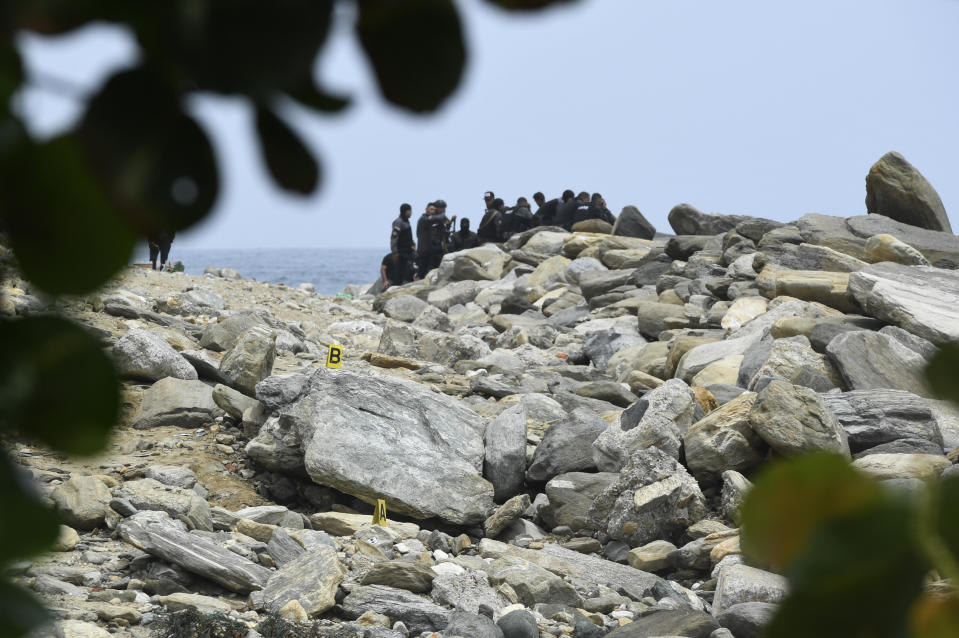 Security forces inspect a coastal area in La Guaira, Venezuela, Sunday, May 3, 2020. Interior Minister Nestor Reverol said on state television that Venezuelan forces overcame an armed maritime incursion by boats from neighboring Colombia before dawn Sunday, in which several attackers were killed and others detained. (AP Photo/Matias Delacroix)