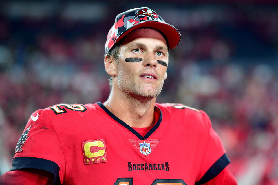 Tom Brady #12 of the Tampa Bay Buccaneers talks to the media after defeating the New Orleans Saints in the game at Raymond James Stadium on December 05, 2022 in Tampa, Florida. The Tampa Bay Buccaneers defeated the New Orleans Saints with a score of 17 to 16.  (Julio Aguilar / Getty Images)