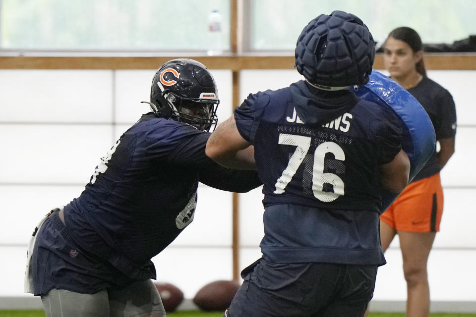Chicago Bears offensive lineman Nate Davis, left, works with offensive lineman Teven Jenkins during NFL football practice in Lake Forest, Ill., Tuesday, June 13, 2023. (AP Photo/Nam Y. Huh) ORG XMIT: ILNH112