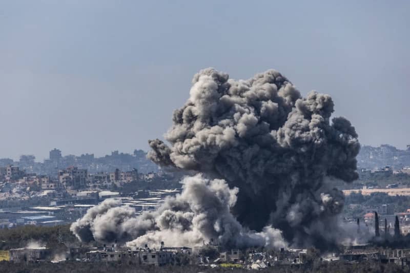 Thick smoke billows from an explosion on the Israel-Gaza border, as seen from Sderot. Ilia Yefimovich/dpa