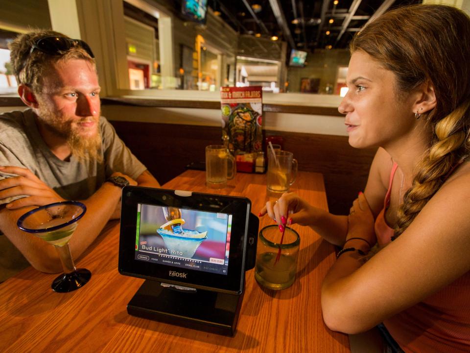 Two customers dine at a Chili's restaurant