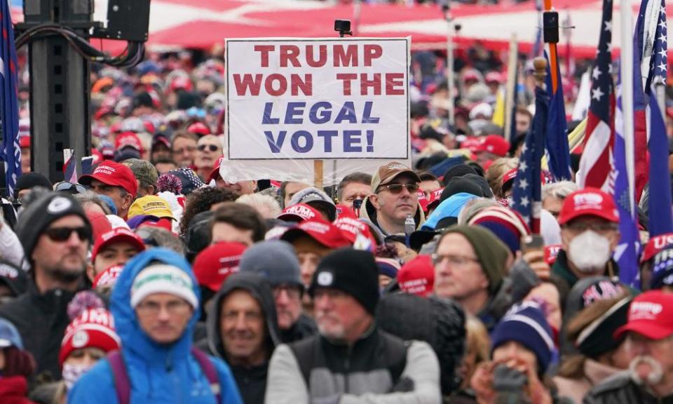 People listen to Trump speak near the White House on 6 January.