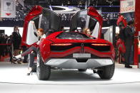 A models sits in the Italdesign Giugiaro Parcour on the first media day of the 2013 Geneva Motor Show.