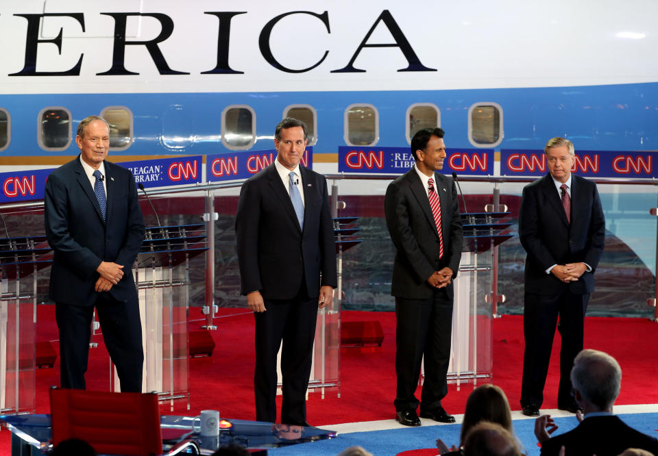 Republican presidential candidates, (L-R) George Pataki, Rick Santorum, Bobby Jindal and Lindsey Graham stand onstage during the presidential debates at the Reagan Library on Sept. 16, 2015, in Simi Valley, California.