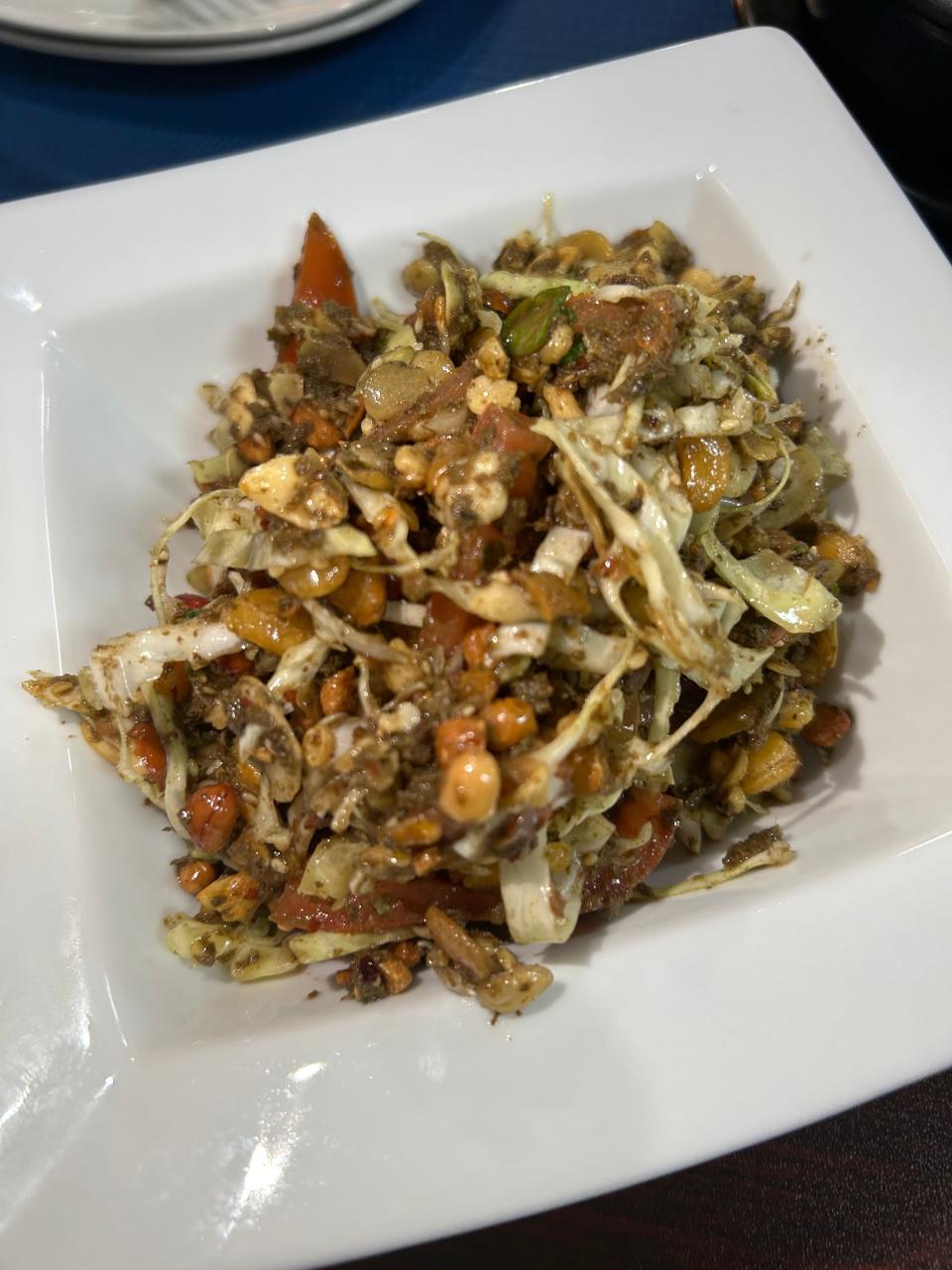 Burmese tea salad at Lyeh Thai is made with tea leaves, crispy beans, cabbage, tomato, nuts and other Burmese ingredients.