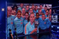 By video-link, Netherlands midfielder Lieke Martens holds her trophy for The Best FIFA women's player of 2017