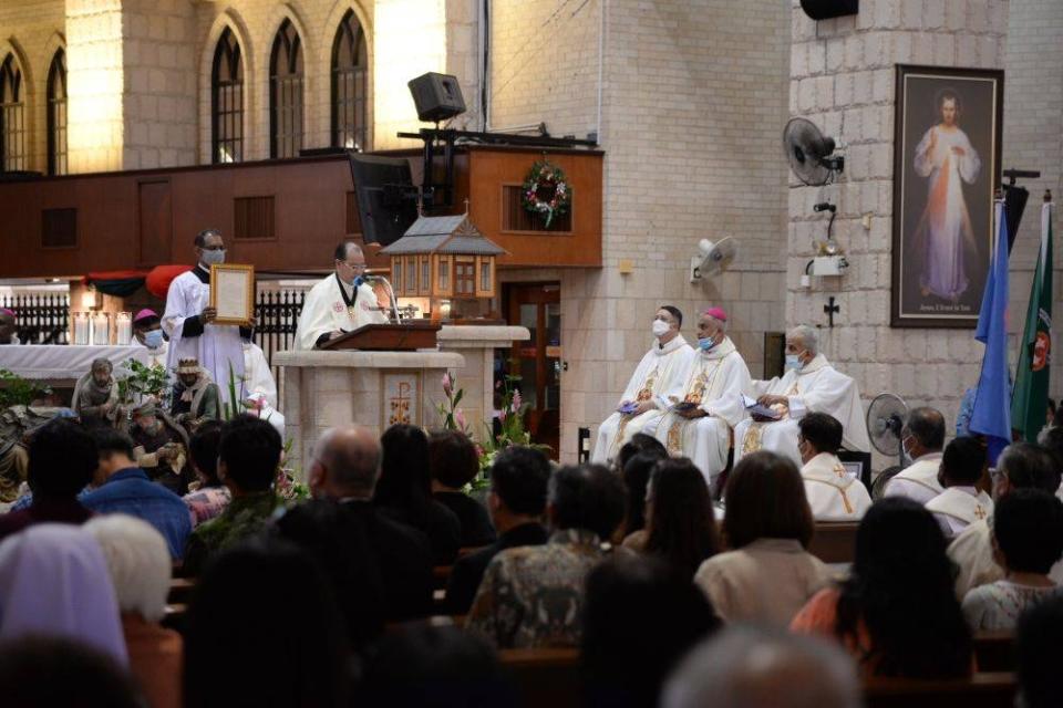 Former St Anne’s Church parish priest, Father Michael Cheah, read out the solemn declaration in Latin and English at the historic ceremony. — Picture by Opalyn Mok