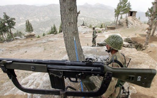 This file photo shows army troopers taking position in the mountains of Shawal along the Pakistan and Afghanistan border, in 2006. A US drone attack on a militant compound in the same area on Sunday killed six insurgents, according to security officials